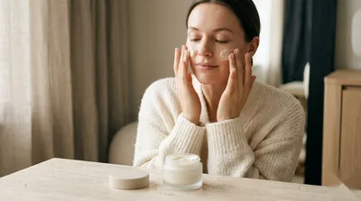 Rich barrier cream applied to cheeks for protected, comforted skin