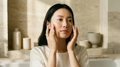 Dewy glass skin as a PDRN ampoule serum is pressed into the cheeks